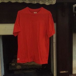 Small orange Fila sports shirt.